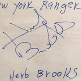 Herb Brooks autographed album page PSA/DNA encapsulated