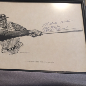 Roberto Clemente autographed Rare 11x14 Robert Riger drawing with a spectactular Mint 9 personalized to a famous Father.  Very rare full name autograph framed.